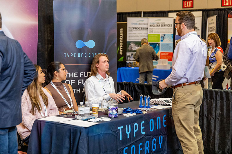 type one energy employees at trade show photo